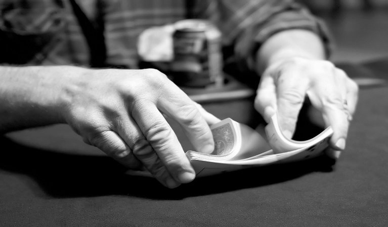 A player shuffling cards.