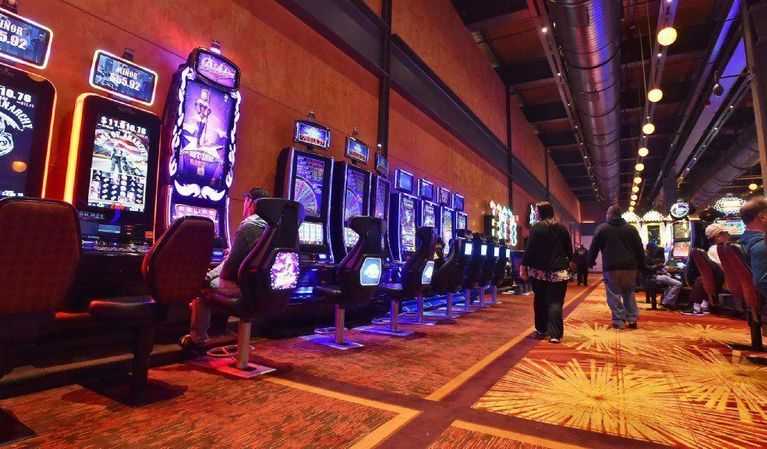 People walking on a casino floor.