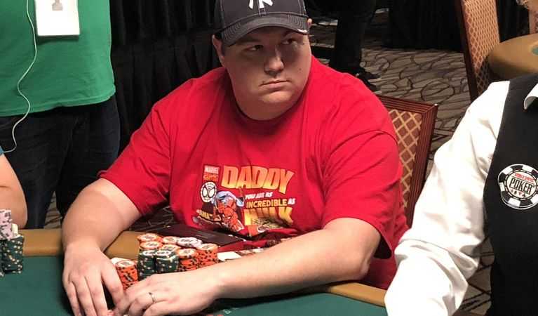 Shaun Deeb sitting at a poker table.