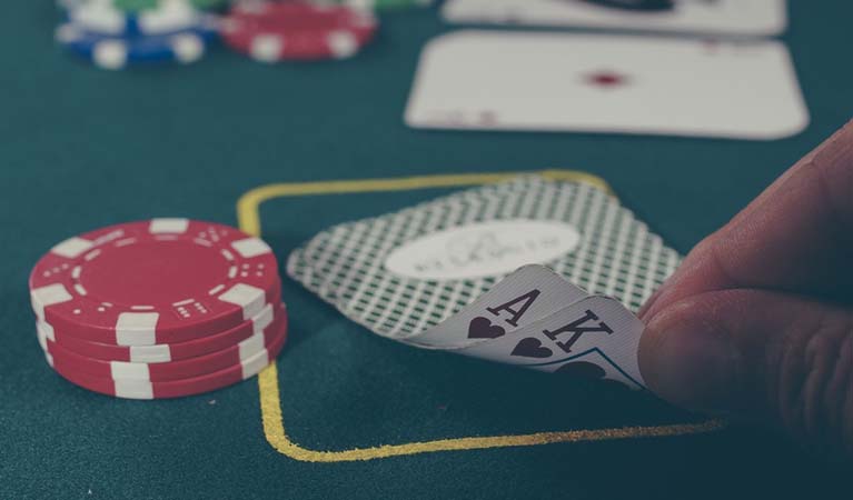 poker felt and table with cards and chips