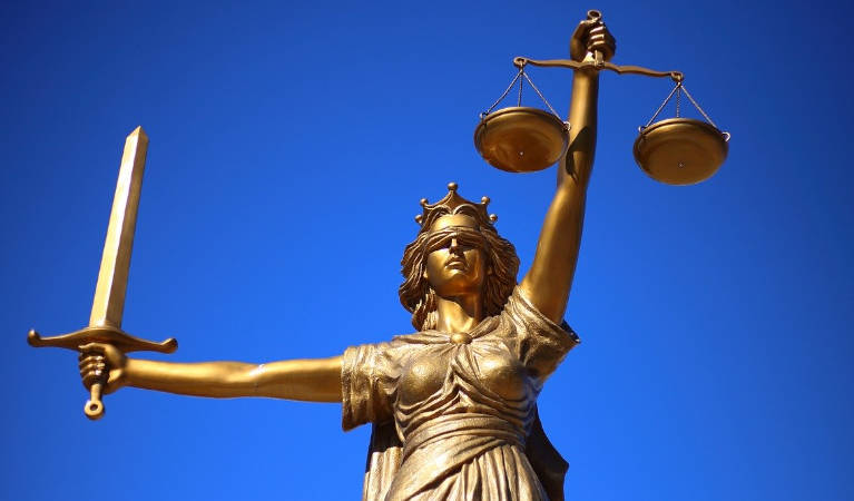 Justice ruling with her scales