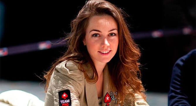 Liv Boeree playing poker with her PokerStars jacket on.