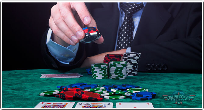 Poker player placing a blind
